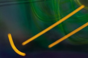 Light Signatures series, day, colour photograph, art, abstract, abstract expressionism, creative, city street, urban, downtown, cityscape, speed, blur, movement, motion, green, oragne, muted, streaks, arc, circles, patterns