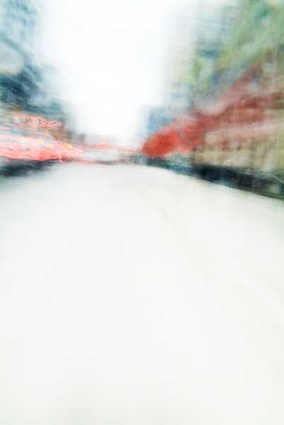 Convergent series, day, colour photograph, art, abstract, abstract expressionism, creative, city street, urban, downtown, cityscape, speed, blur, movement, motion, blue, red, orange, green, vibrant, wedge, shape