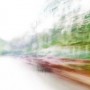 Convergent series, day, colour photograph, art, abstract, abstract expressionism, creative, city street, urban, downtown, cityscape, speed, blur, movement, motion, green, orange, red, vibrant, wedge, shape